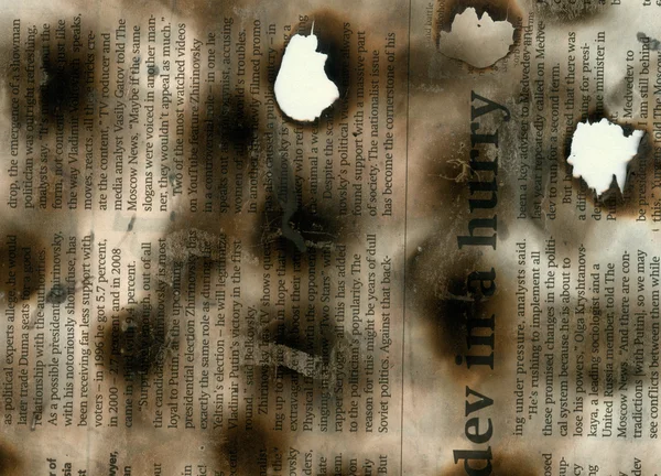 Burnt newspaper — Stock Photo, Image