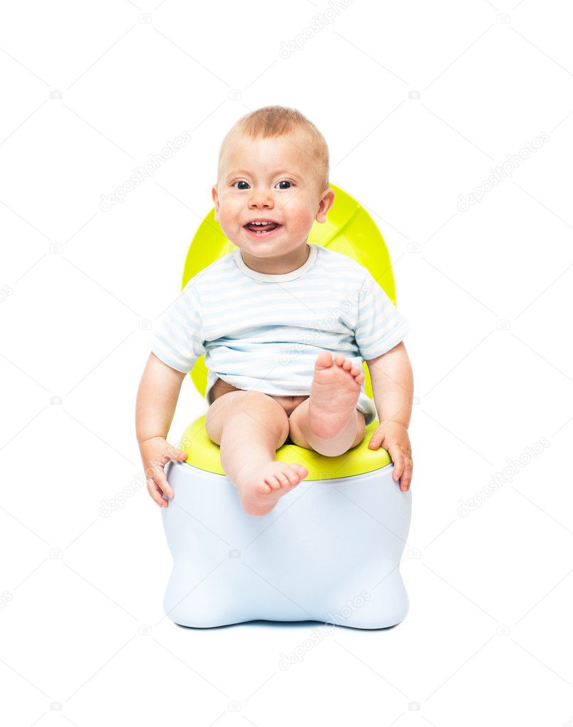 The boy sits on a chamber pot