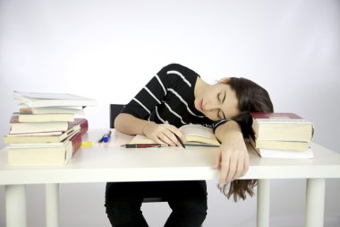 Lazy girl falls asleep while studying clipart