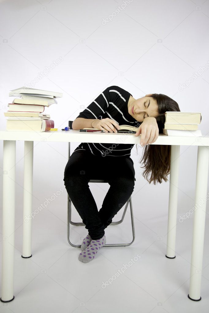 Girl sleeping while studying sitting
