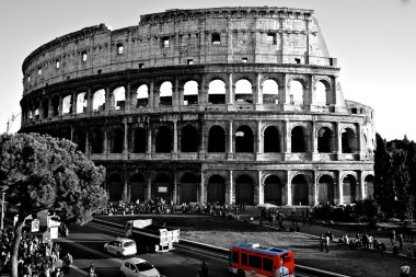 Colosseum with a red bus