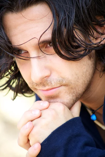 Close-up of a young man thinking — Stock Photo, Image