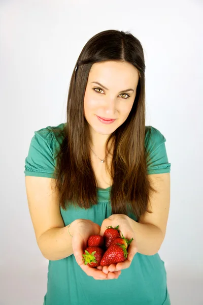 Cute female model with strawberries — Stock Photo, Image