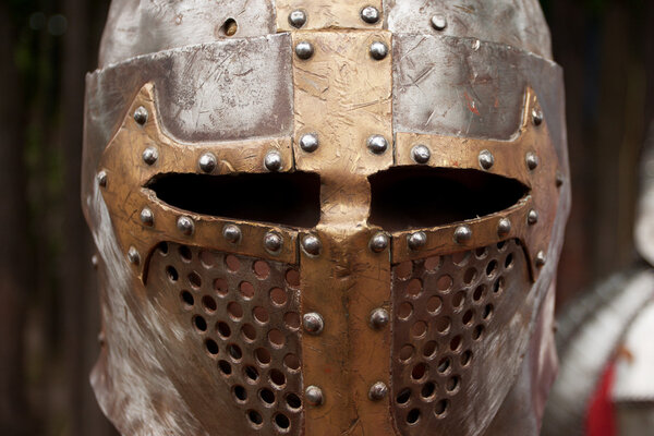 Protective helmet with a visor on medieval knight