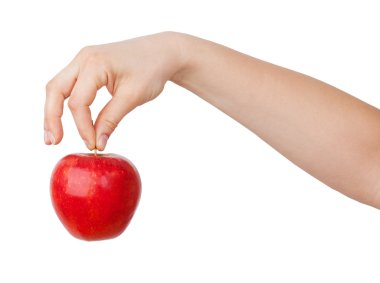 Ripe red apple in his hand clipart