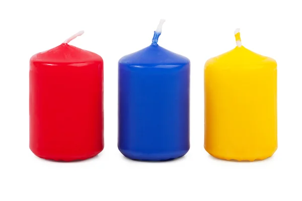 Três pequenas velas coloridas agachadas — Fotografia de Stock