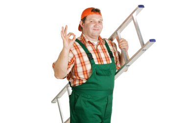 Worker in overalls and a baseball cap clipart