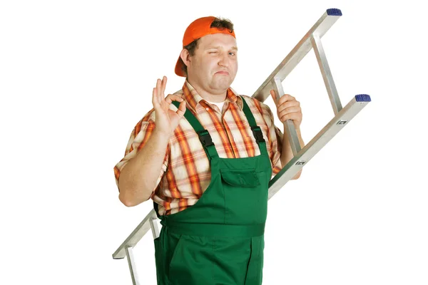 Cheerful worker in overalls with a ladder — Stock Photo, Image