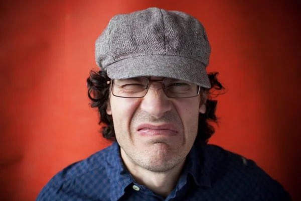 Man with a grimace of displeasure — Stock Photo, Image