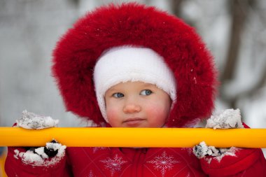 Little girl in a red jumpsuit clipart