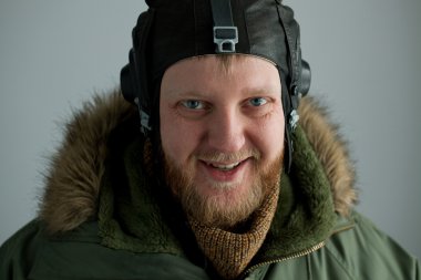 Polar pilot in alaska green jacket clipart