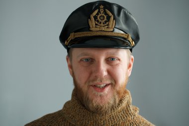 Smiling, bearded captain clipart