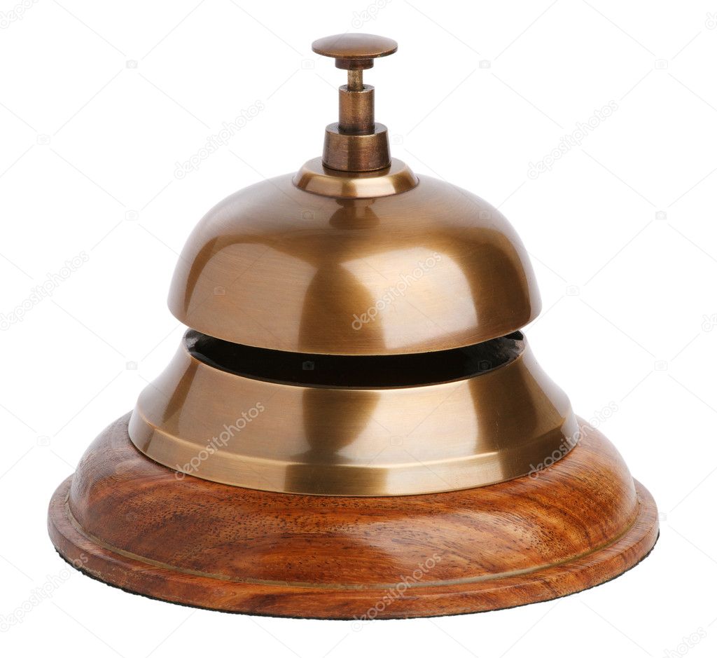 Antique brass bell with a button