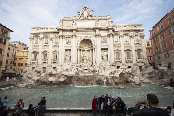 Tourists at the Trevi Fountain in Rome, Italy