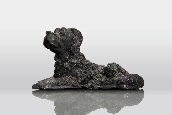 Lava stone in the shape of dog — Stock Photo, Image