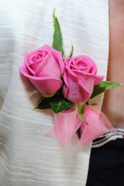 Mothers pink corsage.