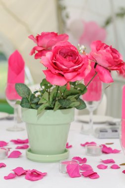 Pink roses decorate table. clipart
