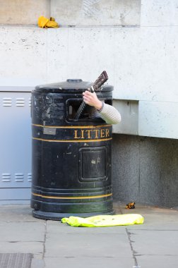 Busker In Bin clipart