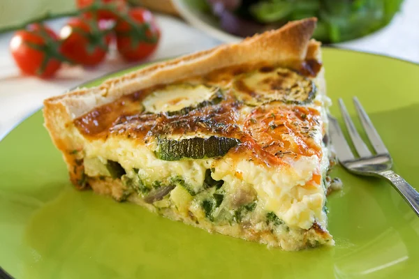 A sliced portion of Zucchini quiche on a plate — Stock Photo, Image