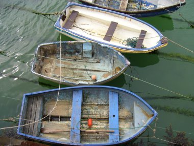 Old fishing boats on ropes clipart