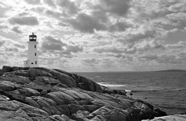 Lighthouse in dramatic sky, black and white clipart