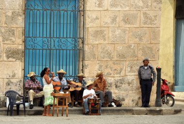 Street musicians perform in Cuba clipart