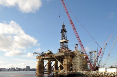 Oil rigged docked for maintenance clipart