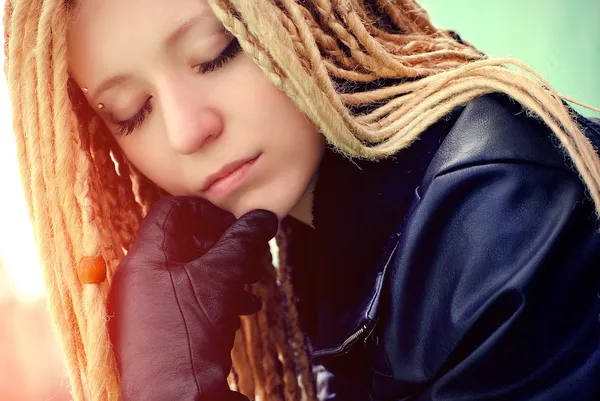 stock image Young beautiful blonde with dreadlocks and pirsing