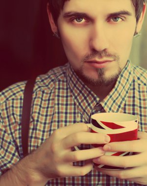 Englishman with a cup clipart