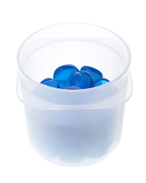 Perline di vetro in un contenitore di plastica — Foto Stock