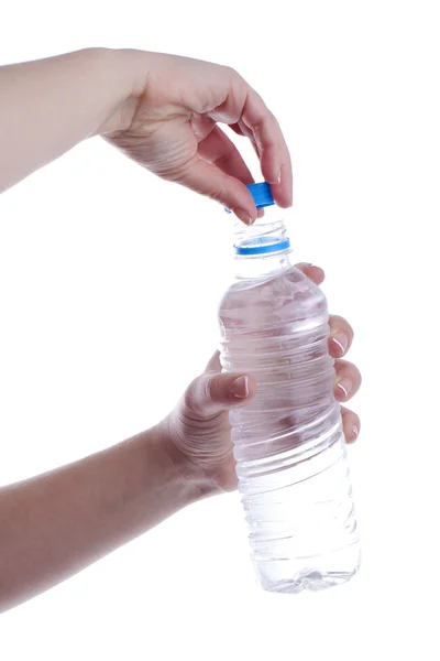 Woman is opening a bottle of water — Stock Photo, Image