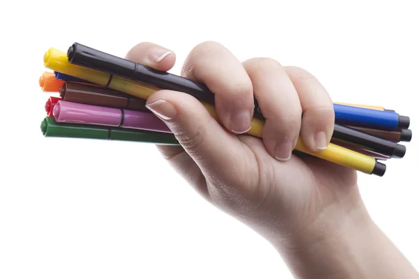Рука с разноцветными ручками — стоковое фото