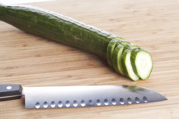 stock image Cucuber with knife