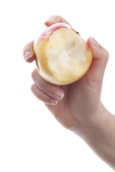 Ruka s jedl jablko — Stock fotografie