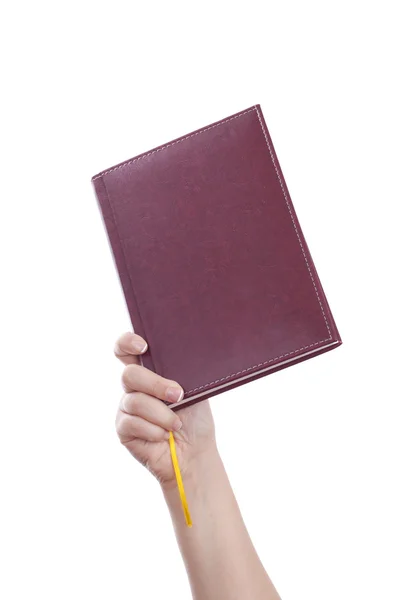 Gospodarstwa zamknięty notebook — Zdjęcie stockowe