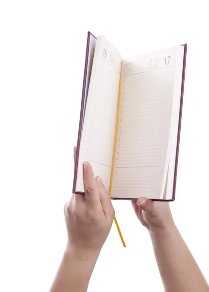 Holding opened notebook — Stock Photo, Image