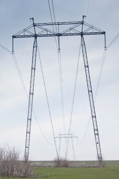 Big power pole in field — Stock Photo, Image