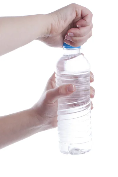 Woman is opening a bottle of water — Stock Photo, Image