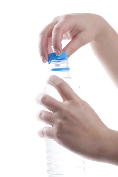 Stock image Woman is opening a bottle of water