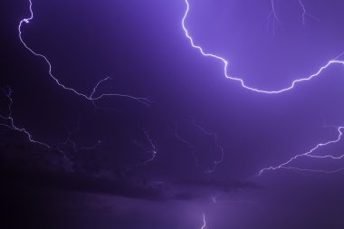 Lightning Illuminates the Night Sky clipart