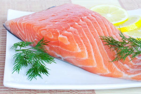 Fresh salmon with lemon and herbs — Stock Photo, Image