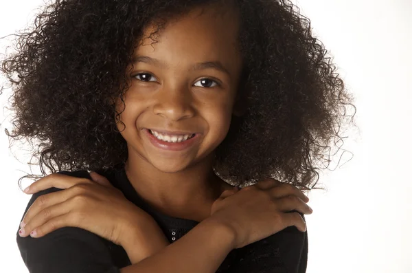 Cute playful little African American girl with curly hair — Stock Photo, Image