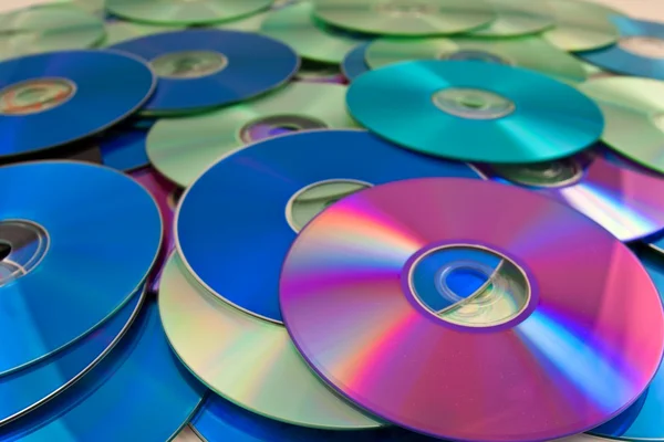 Arka plan olarak kompakt disk yığını — Stok fotoğraf