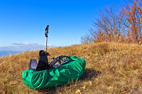 Touristic rucksack lying in a grass — Stock Photo, Image