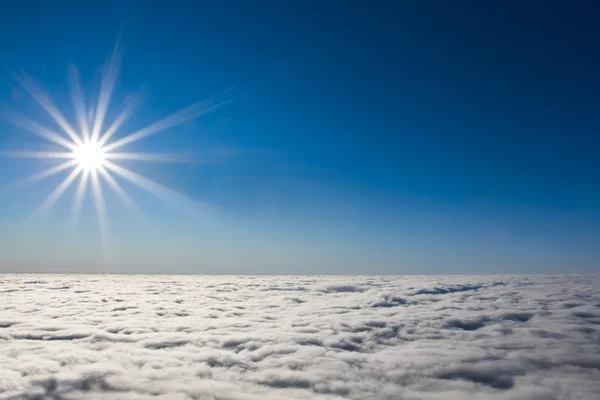 Sparkle sun above dense clouds — Stock Photo, Image