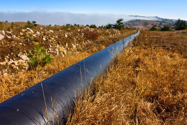 Tubo del gas in una steppa — Foto Stock