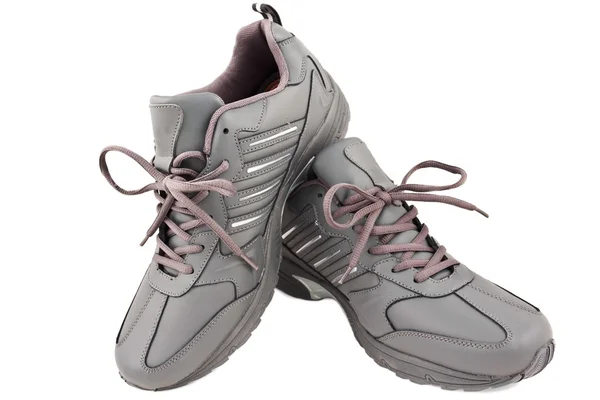 Par de zapatillas grises sobre fondo blanco — Foto de Stock