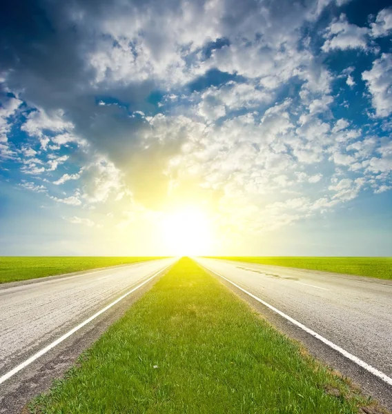 stock image Asphalt road at the sunrise