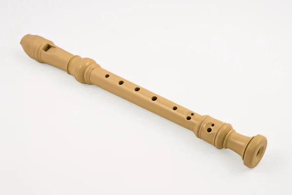 Пластиковая флейта сопрано на белом фоне — стоковое фото