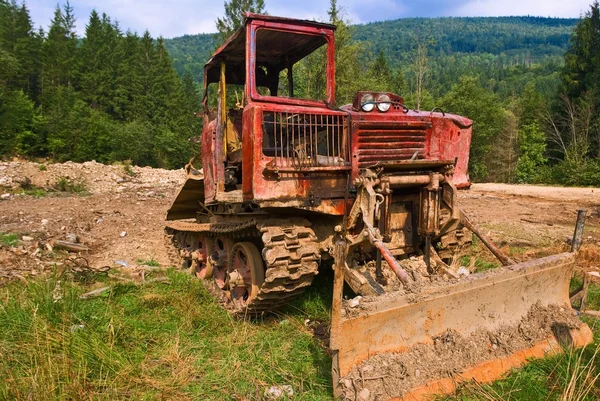 stock image Old tractor in a field